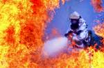 A firefighter from the 51st Civil Engineer Squadron extinguishes a fire started from a simulated plane crash at Osan Air Base, Republic for Korea, during operational readiness exercise Beverly Midnight 12-03, July 23, 2012. Throughout the week, Osan Mustangs demonstrate the ability to operate in a chemical environment as well as administer self-aid and buddy-care during a wartime environment. Airmen also highlight their ability to position, employ and sustain forces and showcase operational read