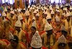 Brides and grooms sit during a mass marriage ceremony on 123 Couples who will be tying the knot out on 1st July 2012 at Haldiram Banquets organisational by Vishwa Jagriti Mission Trust in Kolkata on Sunday 1st July 2012