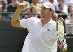 Andy Roddick of the US reacts after defeating Germany's Andreas Beck in their first round match against at the All England Lawn Tennis Championships at Wimbledon, Tuesday, June 21, 2011.