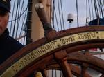 (June 23, 2005) - ONBOARD THE USCGC EAGLE A U.S. Coast Guard Academy cadet takes the helm during a summer training patrol onboard the Coast Guard Cutter EAGLE. The three masted, square-rigged sailing vessel is normally homeported in New London, Connecticut, and sails each summer for months at a time, visiting ports around the U.S. and abroad. EAGLE has a long history in service as a training vessel. After she was built and commissioned in 1936, she served as training vessel for cadets in the Ger