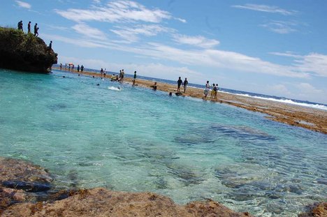 A lagoon is formed by a receded sea shore, Siargao, Philippines.