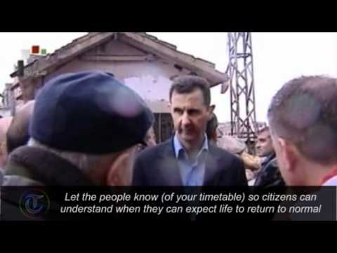 Syria: President Assad tours demolished Homs neighbourhood