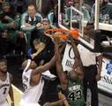 Kendrick Perkins (right) dunking over Brendan Haywood of the Washington Wizards