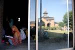 A kashmiri muslim woman read the Quran at historic Jamia Masjid holy month of Ramadan in Srinagar, the summer capital of Indian Kashmir, 29 July 2012. During Ramadan, Muslims refrain from eating, drinking and smoking from dawn to dusk.