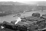 Panorama from Newcastle castle keep across the River Tyne to Gates head in 1954. The public sector in Newcastle began to expand in the 1960s, as more people were employed in local government administration and Newcastle University was founded in 1963, followed by a Polytechnic in 1969; the latter received university status in 1992