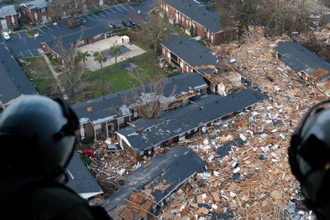 US Navy (USN) aircrew assigned to Naval Air Station Pensacola (NASP) Helicopter Support Unit (HSU), Florida (FL), survey damage from Hurricane Katrina en route to Stennis Space Center (SSC), Mississippi (MS), from NASP to provide support and relief to vic