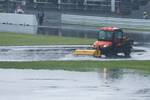 Track workers clearing water from the track during the lengthy red flag period. When the race was restarted, it was behind the safety car which stayed out for eight laps with the order at the front being Vettel, Kobayashi, Massa, Nick Heidfeld and Vitaly Petrov in the two Renaults, Paul di Resta, Webber, Alonso, Pedro de la Rosa, Button, Rosberg and Schumacher