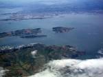 w:San Francisco Bay from the air in May 2010.Aerial view of Angel Island. In 1938, hearings concerning charges of membership in a proscribed political party against labor leader Harry Bridges were held on Angel Island before Dean James Landis of Harvard Law School.