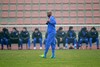 Shanghai Shenhua's Nicolas Anelka, center, prepares to warm up as other team players, in back ground, sit to see before a training soccer match against Hunan Xiangtao Tuesday, Feb. 21, 2012 in Shanghai, China. Anelka joined Chinese Super League club Shanghai Shenhua in January on a transfer from Chelsea.