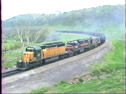 C&NW-Gilford-SBD working hard with WEPX train on the MGA in 1991...