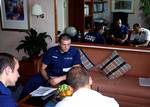 ANCHORAGE, Alaska (July 1, 2005) Petty Officer Third Class Craig Sears and Petty Officer Third Class Brady Osborne went through the Radisson Seven Seas Mariner's security plan, registration and other official documents with Stan de Lancombe, ship's security officer, during a security boarding Wednesday in Whittier. USCG photo by PA2 Sara Francis. (102390) ( PORT SECURITY (FOR RELEASE) )