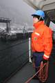 JUNEAU, Alaska - Seaman Aaron Ellis, a crewmember aboard Seattle based 399-foot Coast Guard Cutter Polar Sea, is standing by to throw a heaving line that is connected to a mooring line which holds the cutter in place at the South Franklin Pier Wednesday, Nov. 18, 2009. The Polar Sea became the first American surface ship that sailed to the geographic North Pole on Aug. 22, 1994.U.S. Coast Guard photo by Petty Officer 3rd Class Walter Shinn. (716937) ( Polar Sea )