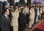 In this image released by the Egyptian President, Egyptian President Mohammed Morsi, third from left, stands with ruling military generals including Field Marshal Hussein Tantawi, second left, and Prime Minister Kamal Ganzouri, left, during a ceremony following his inauguration, at a military base east of Cairo, Egypt, Saturday, June 30, 2012.