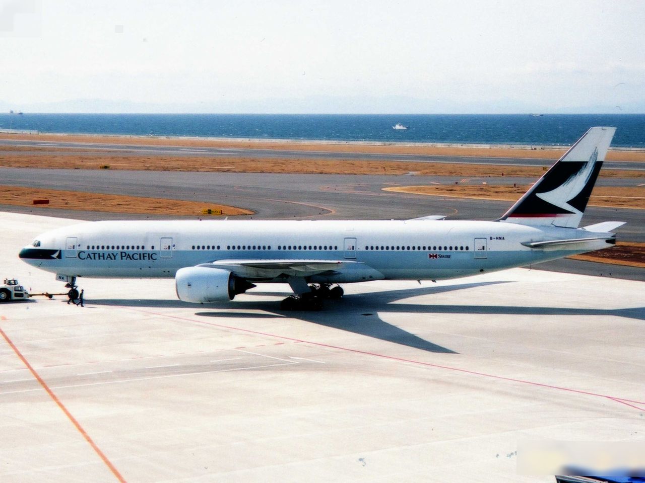 A Cathay Pacific Boeing 777–200 on the tarmac