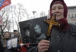 A Ukrainian Orthodox women stands in front of a portrait of Russia's Tsar Nicholas II as she participates in a protest in front of the foreign ministry during a pro-Russian march and anti-NATO religious procession in Kiev, Ukraine, Wednesday, Jan. 17, 2007. The participants of the procession, organized by the Moscow patriarchy of the Ukrainian Orthodox Church, marched to denounce President Victor Yushchenko's pro-NATO and pro-European aspirations.