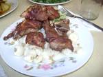 Chicharrón from Huaraz, Ancash Region, Peru - chicharrones can be eaten as an appetizer or snack, and the chicken variant can taste like fried chicken found in the United States. Sides include a kind of red onion relish, fried yuca, and other regional variants.