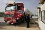 Palestinian truck loaded with gas cooking intervene to Rafah through the crossing Kerem Shalom border between Israel and the southern Gaza Strip on April 09, 2012. -- Israel decided to open the Kerem Shalom crossing in part to the introduction of goods and aid pumping large quantities of industrial diesel for the Gaza Power Plant, will also be pumping limited amounts of gas cooking. Photo by AHMED DEEB/WN