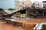 A night club, destroyed by floods, is seen in Mersin, southern Turkey, Wednesday, Nov. 1, 2006. Flash floods swept away a minibus carrying wedding guests in southeastern Turkey, killing 14 people, as torrential rain fell across the country. Eight other p