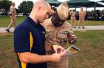 Rear Adm. Earl L. Gay, commander of Navy Recruiting Command, is shown information about pillar prep, a component of the Navy Operational Fitness and Fueling System (NOFFS).