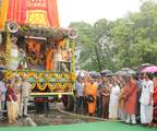 West Bengal Chief Minister Mamata Banerjee hold the Rope including devotees from the International Society for Krishna Consciousness (ISKCON), participate in the Sri Krishna Rath Yatra in Kolkata on June 21, 2012. According to mythology, the Rath Yatra dates back some 5,000 years when Hindu God Krishna along with his older brother Balaram and sister Subhadra were pulled on a chariot from Kurukshetra to Vrindavana by Krishna's devotees