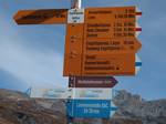 Swiss hiking path signs for mountain path and alpine route at Engstligenalp, Adelboden, Switzerland