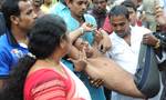 An injured person being carried to a hospital in Kolkata on Tuesday after an accident that took place where the connecting rope of a