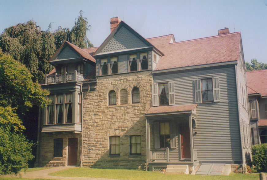 A large three story house of wood and stone