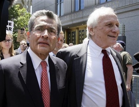 Former Goldman Sachs director Rajat Gupta, left, and his attorney Gary P. Naftalis, leave federal court in New York, Friday, June 15, 2012. Gupta, accused of feeding confidential information to a corrupt hedge fund manager, has been convicted of conspiracy and three counts of securities fraud.