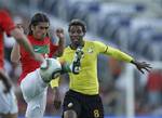 Portugal`s Pedro Mendes, left, battles for the ball with Mozambique`s Fumo during a warm-up match at the Wanderers stadium in Johannesburg, Tuesday, June 8, 2010. Portugal will play in Group G at the soccer World Cup scheduled to start on June 11.