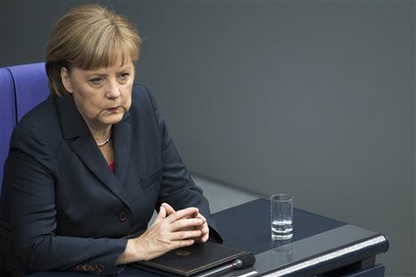 German Chancellor Angela Merkel reacts before her speech prior to the upcoming G20 summit at the Bundestag in Berlin, Germany