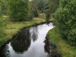 River Vienne in wooded landscape near Peyrelevade, close to its source on the Millevaches Massif. The Vienne is one of the most important rivers in south-western France, a significant left tributary of the lower Loire.