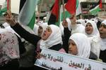 Palestinian girls schools students gather as they protest in the Rafah, southern Gaza Strip on March 03, 2012, Five days following violence in the flashpoint Al-Aqsa mosque compound in Jerusalem's Old City, between Israeli forces and Palestinians. The unrest is believed to have been fuelled by web postings by Israeli rightists urging Jews to visit the mosque compound and assert Israeli sovereignty over the site, one of the most sensitive in the Middle East. Know to Muslims as Al-Haram Al-Sharif