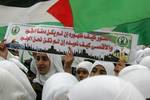 Palestinian girls schools students gather as they protest in the Rafah, southern Gaza Strip on March 03, 2012, Five days following violence in the flashpoint Al-Aqsa mosque compound in Jerusalem's Old City, between Israeli forces and Palestinians. The unrest is believed to have been fuelled by web postings by Israeli rightists urging Jews to visit the mosque compound and assert Israeli sovereignty over the site, one of the most sensitive in the Middle East. Know to Muslims as Al-Haram Al-Sharif