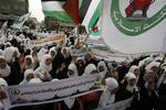 Palestinian girls schools students gather as they protest in the Rafah, southern Gaza Strip on March 03, 2012, Five days following violence in the flashpoint Al-Aqsa mosque compound in Jerusalem's Old City, between Israeli forces and Palestinians. The unrest is believed to have been fuelled by web postings by Israeli rightists urging Jews to visit the mosque compound and assert Israeli sovereignty over the site, one of the most sensitive in the Middle East. Know to Muslims as Al-Haram Al-Sharif