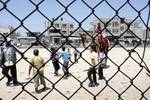 Palestinian Children visit a luna park in the Rafah refugee camp, during the Eid el-Fitr holiday in the southern Gaza Strip on August 20, 2012. Eid al-Fitr day is a holiday for Muslims which marks the end of Ramadan, the Islamic holy month of fasting.Photo by Ahmed Deeb / WN