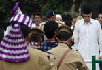 Jammu and kashmir chief minister Omar Abdullah bow their heads to pay tribute during a ceremony marking Martyrs' Day at the Mazar-e-Shohda (Martyr's graveyard) in Srinagar , the summer capital of Indian Kashmir, 13 July 2012. Authorities Friday clamped severe restrictions in Srinagar city, the region's summer capital to thwart the separatist march on the eve of Martyrs' day in Indian Kashmir.The restrictions were enforced by contingents of Indian police and paramilitary troopers of India's Centr