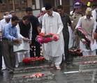 Jammu and kashmir chief minister Omar Abdullah lays a wreath on a grave stone during a ceremony marking Martyrs' Day at the Mazar-e-Shohda (Martyr's graveyard) in Srinagar , the summer capital of Indian Kashmir, 13 July 2012. Authorities Friday clamped severe restrictions in Srinagar city, the region's summer capital to thwart the separatist march on the eve of Martyrs' day in Indian Kashmir.The restrictions were enforced by contingents of Indian police and paramilitary troopers of India's Centr