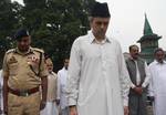 Jammu and kashmir chief minister Omar Abdullah bow their head to pay tribute during a ceremony marking Martyrs' Day at the Mazar-e-Shohda (Martyr's graveyard) in Srinagar , the summer capital of Indian Kashmir, 13 July 2012. Authorities Friday clamped severe restrictions in Srinagar city, the region's summer capital to thwart the separatist march on the eve of Martyrs' day in Indian Kashmir.The restrictions were enforced by contingents of Indian police and paramilitary troopers of India's Centra