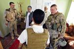 U.S. Army Lt. Col. Anthony Ulrich (right), Provincial Reconstruction Team Farah Civil Affairs Commander, discusses security with local officials in Farah City, Farah province, Afghanistan, Aug. 29. PRT Farah is a unit of soldiers, sailors and airmen working with various government and non-government agencies tasked with facilitating governance and stability in the region by working hand in hand with local officials and the Government of the Islamic Republic of Afghanistan. The goal of the PRT is