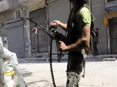 In this image made from video and accessed Saturday, Sept. 1, 2012, Free Syrian Army fighters take up positions during fighting with Syrian troops in Aleppo, Syria.