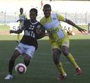 Bhawanipore Footballer José Ramirez Barreto (Yellow and White Jersey ) in action against the Md.Sporting ( Black and White jersey ) during the Kolkata Premier League Division Football Match at Yuba Bharati Krirangan Stadium , Saltlake on Friday 07 September 2012