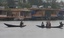 People travelling shikara  at World Famous Dal Lake during a rain in Srinagar on Sunday 09, September 2012. Incessant rains continued to lash Kashmir since Saturday night, sparking crop damage fears among the farming community of the Valley.