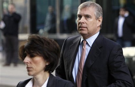 Britain's Prince Andrew, background arrives in Canary Wharf, to visit the headquarters of the London CrossRail project in London, Monday, March, 7, 2011. Prince Andrew will have to decide whether he can continue his role as a trade envoy amid a controversy about his links to a convicted pedophile, a British Cabinet minister said Monday.