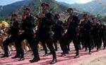 Indian commandos from Jammu and Kashmir police take part in a passing out parade at a police training centre in Lethpora Awantipora, some 25 kilometers south of Srinagar, Kashmir, India, 20 July, 2012. A total of 937 recruits were formally inducted into the Jammu and Kashmir police after completing nine months of rigorous training in physical fitness, weapon handling, counter insurgency and dealing with the law and order situation, a police official said.