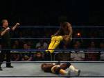 Kofi Kingston performing the Boom Drop on Shelton Benjamin