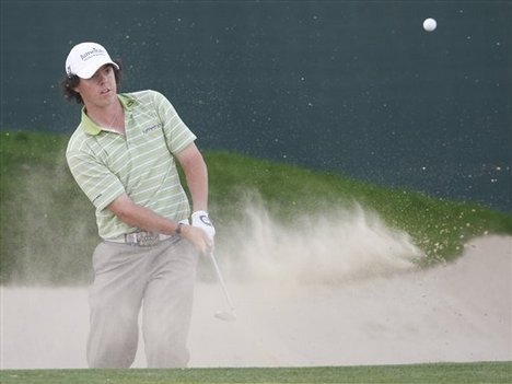 Rory McIlroy from Northern Ireland plays a ball on the 18th hole during final day of Desert Classic golf tournament in Dubai, United Arab Emirates, Sunday, Feb. 1, 2009.