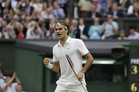 Roger Federer of Switzerland against Novak Djokovic of Serbia during a semifinals match at the All England Lawn Tennis Championships at Wimbledon, England, Friday, July 6, 2012.