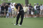 Tiger Woods hits off of the eighth fairway during a practice round for the Masters golf tournament Tuesday, April 3, 2012, in Augusta, Ga.