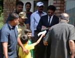 Fans get Autograph Indian Bollywood film actor Shah Rukh Khan during a press conference in Srinagar on September 6, 2012. Shah Rukh, who completed his nine-day shooting schedule in the Valley for Indian filmmaker Yash Chopra's untitled project, is confident that people from South Asia and South East Asia will visit the valley when they watch the movie, which has been extensively shot in Kashmir.