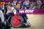 U.S. Navy retired William Groulx, U.S. Wheelchair Rugby Captain, rolls into position to defend against the Great Britain team during a match at the basketball arena during the London Paralympic Games, Sept. 5, 2012. The Paralympic Games are a major international multi-sport event where athletes with a physical disability compete; this includes athletes with mobility disabilities, amputations, blindness, and cerebral palsy. (U.S. Air Force photo by MSgt Sean M. Worrell)